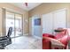 Comfortable home office featuring tiled floors, closet and a sliding glass door to the outdoor patio at 42225 N Celebration Way, Phoenix, AZ 85086