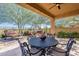 Outdoor seating area with a decorative metal table, chairs and fire pit for enjoying the outdoors at 42225 N Celebration Way, Phoenix, AZ 85086