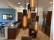 Close-up of unique hanging pendant lights in the kitchen, highlighting the modern design at 42225 N Celebration Way, Phoenix, AZ 85086