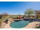 Inviting pool and spa with stone accents and desert views, perfect for outdoor living at 42225 N Celebration Way, Phoenix, AZ 85086