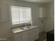 Small kitchen with white cabinets and a double sink at 510 W 14Th St, Tempe, AZ 85281