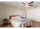 Comfortable bedroom with a queen-size bed, ceiling fan, and plenty of closet space at 518 E Colgate Dr, Tempe, AZ 85283