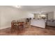 Cozy dining area with a round table and four chairs, adjacent to the living room at 518 E Colgate Dr, Tempe, AZ 85283