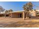 Tan colored exterior with carport and small front yard at 518 E Colgate Dr, Tempe, AZ 85283