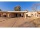 Tan colored exterior with carport and small front yard at 518 E Colgate Dr, Tempe, AZ 85283