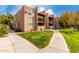 Exterior view of building, showing landscaping and walkway at 5525 E Thomas Rd # M15, Phoenix, AZ 85018