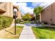 Paved pathway with benches and grills in a landscaped courtyard at 5525 E Thomas Rd # M15, Phoenix, AZ 85018