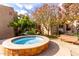 Circular water feature with tiled accents and a bench nearby at 5525 E Thomas Rd # M15, Phoenix, AZ 85018