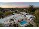 Magnificent aerial view showcases a modern home with pool, lush landscaping, and outdoor living spaces at 6039 E Laurel Ln, Scottsdale, AZ 85254