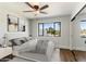 Bedroom with hardwood floors, natural light, carpet floors, and a view of a large backyard at 6039 E Laurel Ln, Scottsdale, AZ 85254