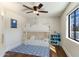 Charming bedroom with bunk beds, ceiling fan and bright blue accents at 6039 E Laurel Ln, Scottsdale, AZ 85254