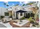 Inviting courtyard with comfortable outdoor seating, lush landscaping, and modern architecture at 6039 E Laurel Ln, Scottsdale, AZ 85254