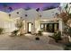 Contemporary home exterior with a well-manicured courtyard and modern architectural details at 6039 E Laurel Ln, Scottsdale, AZ 85254