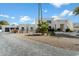 Modern home showcasing clean lines, desert landscaping, and a paved driveway at 6039 E Laurel Ln, Scottsdale, AZ 85254