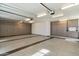 Spacious garage with ample storage cabinets and epoxy flooring at 6039 E Laurel Ln, Scottsdale, AZ 85254