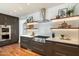 Gourmet kitchen featuring stainless steel appliances, open shelving, and hardwood floors at 6039 E Laurel Ln, Scottsdale, AZ 85254