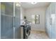 Well-organized laundry room features modern appliances, ample storage, and tile flooring at 6039 E Laurel Ln, Scottsdale, AZ 85254