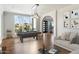 Bright living room featuring a pool table and large windows with outdoor views at 6039 E Laurel Ln, Scottsdale, AZ 85254