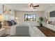 Cozy main bedroom with a large window, hardwood floors, and a sitting area with an ensuite bathroom at 6039 E Laurel Ln, Scottsdale, AZ 85254