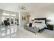 Elegant main bedroom featuring an abundance of natural light, stylish furniture, and modern decor at 6039 E Laurel Ln, Scottsdale, AZ 85254