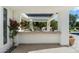 Outdoor kitchen with a stone counter overlooking a pool and landscaped backyard at 6039 E Laurel Ln, Scottsdale, AZ 85254