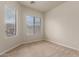 Bright bedroom with carpeted floor and two windows at 6067 E Knolls S Way, Cave Creek, AZ 85331