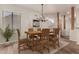 Dining room with rustic wooden table and chandelier at 6067 E Knolls S Way, Cave Creek, AZ 85331