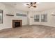 Living room with fireplace and large windows at 6067 E Knolls S Way, Cave Creek, AZ 85331