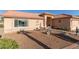 Single-story home with a side yard patio and gravel landscaping at 6331 S Cypress Point Dr, Chandler, AZ 85249