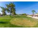 Landscaped golf course with trees and homes at 6331 S Cypress Point Dr, Chandler, AZ 85249