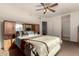 Spacious main bedroom with built-in cabinets and ceiling fan at 6331 S Cypress Point Dr, Chandler, AZ 85249