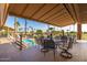 Community patio with seating area overlooking pool and golf course at 6331 S Cypress Point Dr, Chandler, AZ 85249