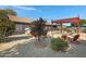 Landscaped backyard with pergola, fire pit and seating at 7029 S 16Th Way, Phoenix, AZ 85042