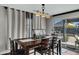 Dining area with a wooden table and sliding glass doors at 7029 S 16Th Way, Phoenix, AZ 85042