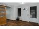 Bright entryway with wood flooring and a bookcase at 7029 S 16Th Way, Phoenix, AZ 85042