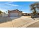 Two-car garage and a large driveway at 7029 S 16Th Way, Phoenix, AZ 85042