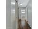 Clean and bright hallway with wood flooring at 7029 S 16Th Way, Phoenix, AZ 85042