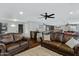 Spacious living area with leather sofas and a home bar at 7029 S 16Th Way, Phoenix, AZ 85042