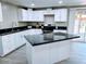 Modern kitchen with island and dark countertops at 7150 W Montecito Ave, Phoenix, AZ 85033