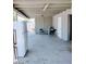 Covered patio with concrete flooring, table and chairs, and refrigerator at 7150 W Montecito Ave, Phoenix, AZ 85033