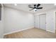 Bright bedroom with light walls, ceiling fan, and wood-look flooring at 7343 E Villa Way, Scottsdale, AZ 85257