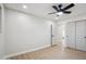 Bright bedroom with modern doors and wood-look flooring at 7343 E Villa Way, Scottsdale, AZ 85257