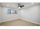 Spacious bedroom featuring light walls, wood flooring, and a ceiling fan at 7343 E Villa Way, Scottsdale, AZ 85257