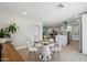 Bright dining area with modern table and chairs, adjacent to a renovated kitchen at 7343 E Villa Way, Scottsdale, AZ 85257