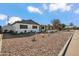 Charming single story home with a well-manicured front yard and modern facade at 7343 E Villa Way, Scottsdale, AZ 85257