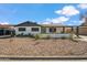 Updated single-level home with a landscaped front yard and carport at 7343 E Villa Way, Scottsdale, AZ 85257