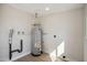 Laundry area with new flooring and water heater at 7343 E Villa Way, Scottsdale, AZ 85257