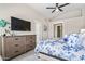 Bright bedroom featuring a large TV and dresser at 7365 E Adele Ct, Scottsdale, AZ 85255