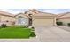 Beautiful desert home with artificial turf lawn and two-car garage at 7365 E Adele Ct, Scottsdale, AZ 85255