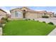 Landscaped front yard with artificial turf and desert landscaping at 7365 E Adele Ct, Scottsdale, AZ 85255